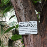 Warning sign near the trail to the Red Sand Beach, Maui